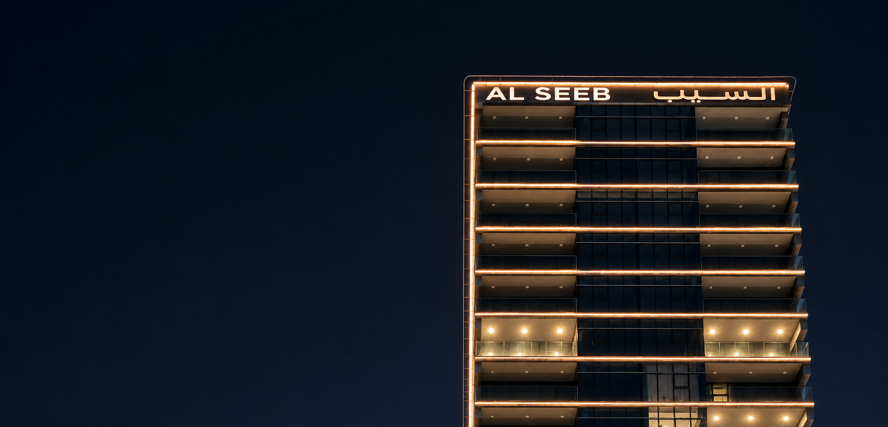 Al Seeb building facade lighting and signage at night supplied as Bright Mark project material.